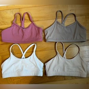Four Athleta Girls sports bras, size 8/10